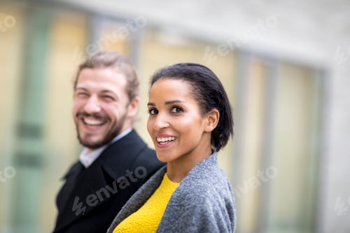 Preview: Portrait of laughing young woman with her partner in the background
