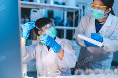 Preview: researcher working in laboratory for medicals science research using scientific equipment technology
