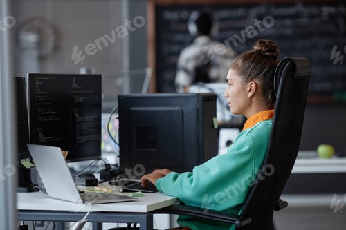Preview: Woman developing software on computer