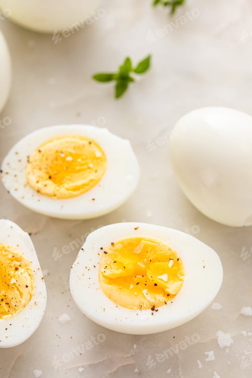 Preview: Boiled eggs peeled and cut in half with salt and pepper