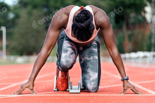Preview: Athlete sprinter in starting position