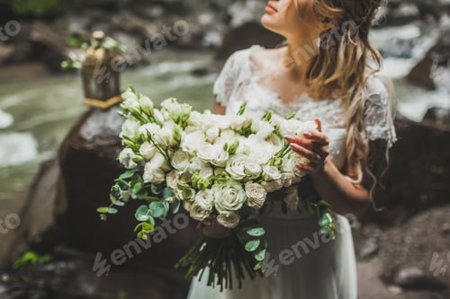 Preview: Blonde Woman Holding Bouquet of Flowers Outdoor