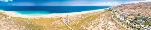 Preview: White sandy beach and blue water in Morro Jable, south of Fuerteventura, Canary islands
