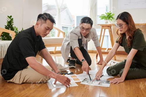Preview: Team of Architects Working with Papers
