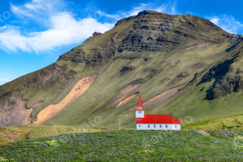 Preview: Impressive view of Vikurkirkja christian church in front of mouintain