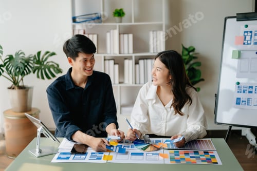 Preview: UX developer and ui designer brainstorming about mobile app interface wireframe design