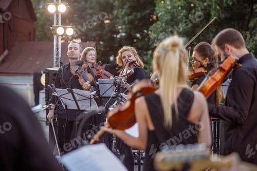 Preview: Orchestra having concert rehearsal on the street
