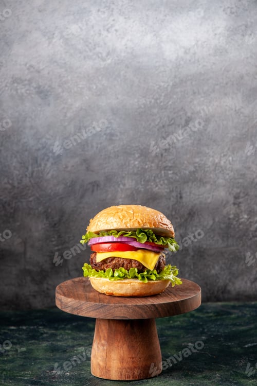 Preview: Tasty sandwich on wooden cutting board on dark mix color background with free space