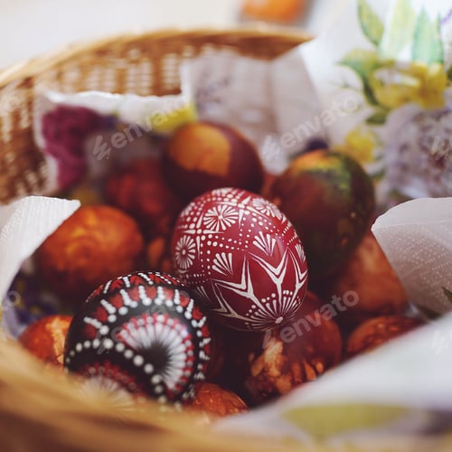 Preview: a closeup of painted easter eggs in a basket