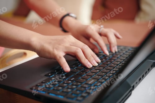Preview: Typing on Laptop Keyboard in Office Setting