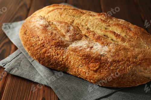 Preview: Freshly baked sourdough bread on wooden table, closeup