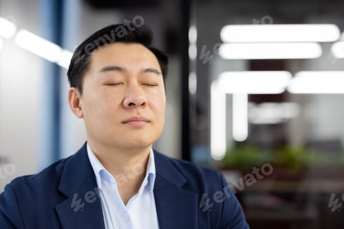 Preview: Asian man inside office close up, mature boss in business suit with closed eyes meditating