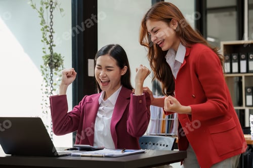 Preview: Good teamwork result concept. Excited successful business people, celebrating win. Happy business te