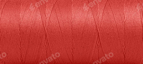 Preview: Texture of threads in a spool of red color on a white background