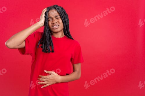Preview: African woman gesturing bodily discomfort and headache