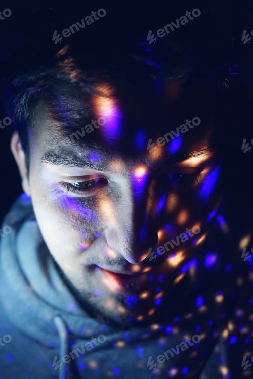 Preview: Portrait of a young man with lights in his face