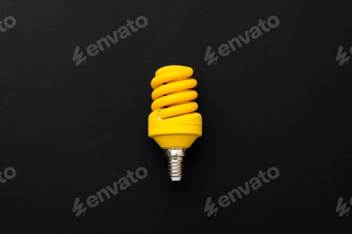 Preview: One light bulb on black background top view