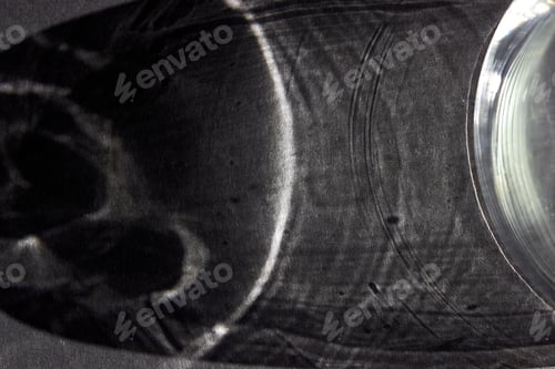 Preview: Dark gray abstract background for design, social networks, space for text. The shadow of a glass cup