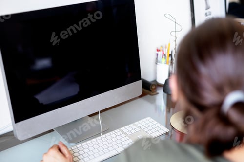 Preview: Businesswoman working on a computer screen