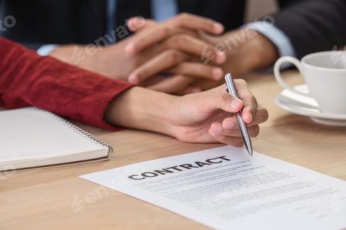 Preview: Closeup Young Asian woman graduate hand signing the contract