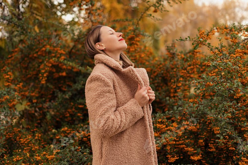 Preview: Beautiful woman enjoying the colourful nature smiling