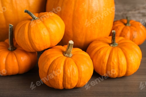 Preview: Fresh ripe pumpkins on wooden table, closeup