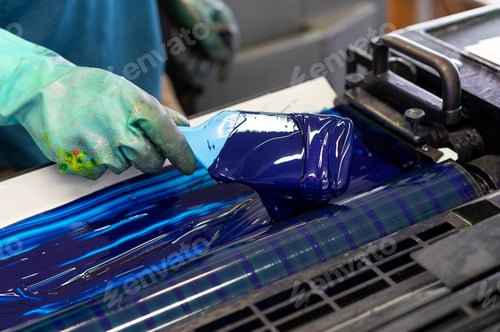 Preview: Crop worker smearing paint on printer rollers
