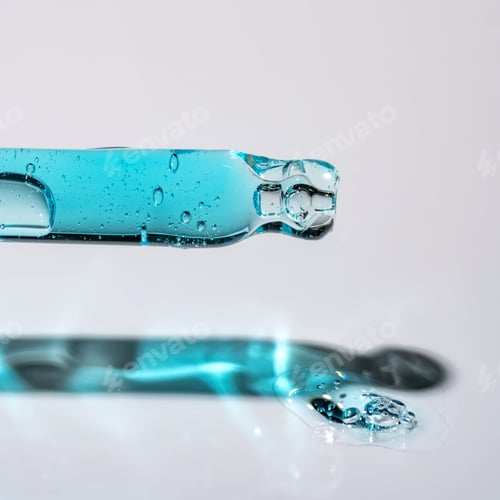Preview: Pipette and drops and smears of cosmetics. Liquid blue gel or a drop of serum on blue background.