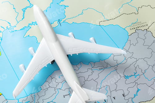 Preview: miniature of a passenger aircraft flying on a map