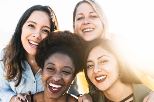 Preview: Portrait of happy multiracial women having fun outdoor