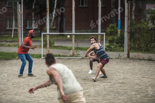 Preview: group of young multiethnic men playing baseball on court