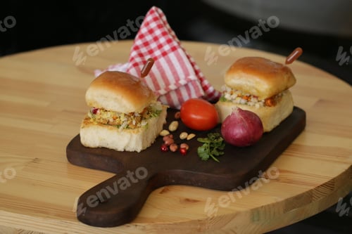 Preview: Appetizing burgers on wooden board in the cafe
