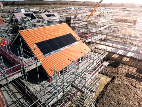 Preview: The roof of a new build house under construction with integrated solar panels