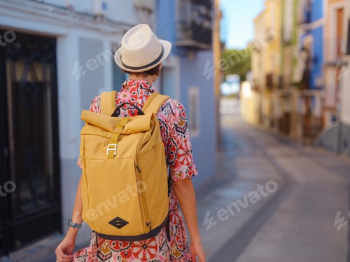 Preview: Woman strolls through colorful streets of Spanish coastal town