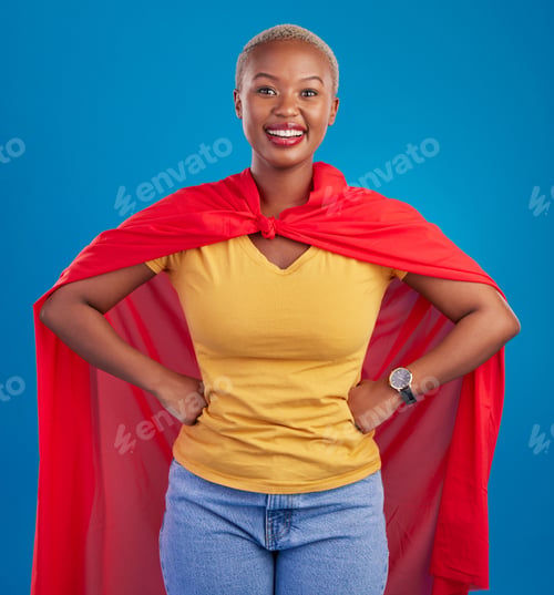 Preview: Black woman, superhero cape and portrait in studio, blue background and fashion. Happy female model