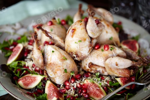 Preview: Close up of serving plate of roasted wildfowl and figs
