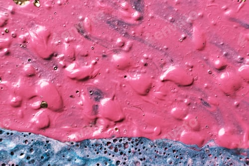Fluid Art. Bubble paint abstraction. Tactile bumpy pink paint background or texture close-up.
