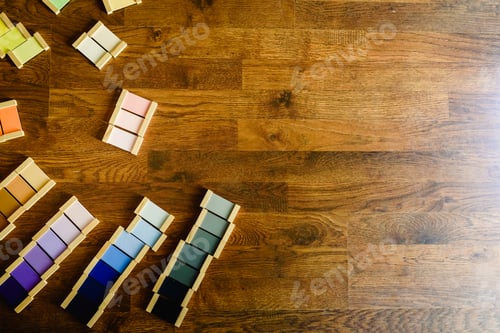 Preview: Montessori color tablets on wooden floor background