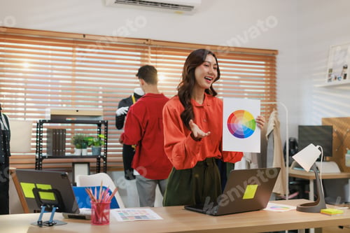 Preview: Fashion designer woman presenting color palette to team