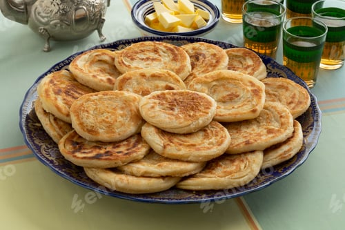 Preview: Fresh baked meloui, Moroccan pancakes, butter and tea