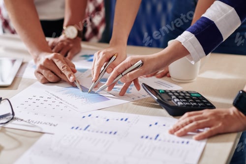 Preview: Business Meeting In Office Discussing Graphs And Data