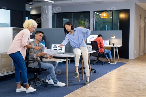 Preview: In modern office, diverse young team discussing work