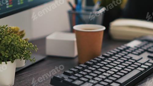 Preview: Company files and coffee on table in accounting office, close up