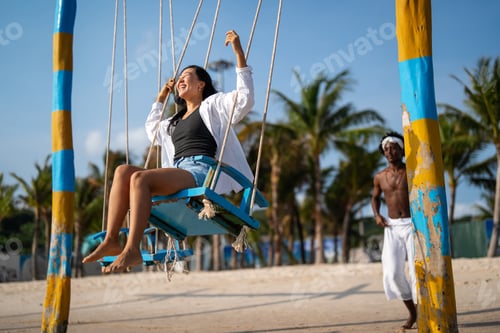 Preview: Beautiful diverse couple enjoying in good mood on the beach. Lifestyle love dating vacation concept