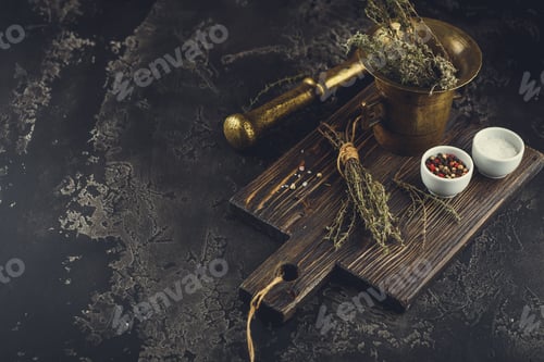 Preview: Thyme. Bunch of fresh herb thyme in bronxe mortar on rusty background