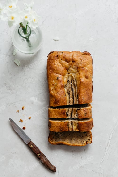 Preview: Sliced Banana Bread with Flowers and Knife