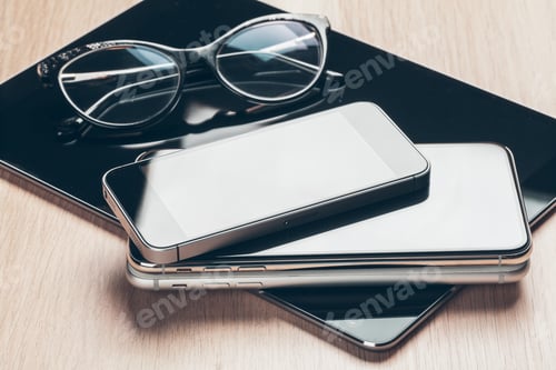 Preview: Digital tablet and mobile phone. Electronic devices on wooden table, close up