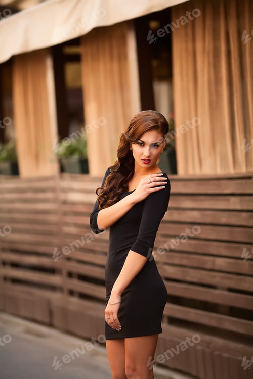Preview: beautiful sexy brunette on a city street