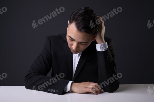 Preview: Handsome male in a studio posing for a photo