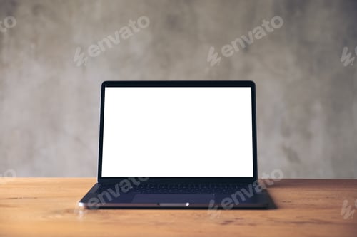 Preview: Mockup image of laptop with blank white desktop screen on wooden table with concrete wall background
